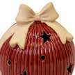 Studio close-up of the cream ceramic bow and red ribbed glaze