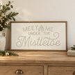 Wood & Metal Sign - White And Gold Meet Me Under The Mistletoe on an oak console.