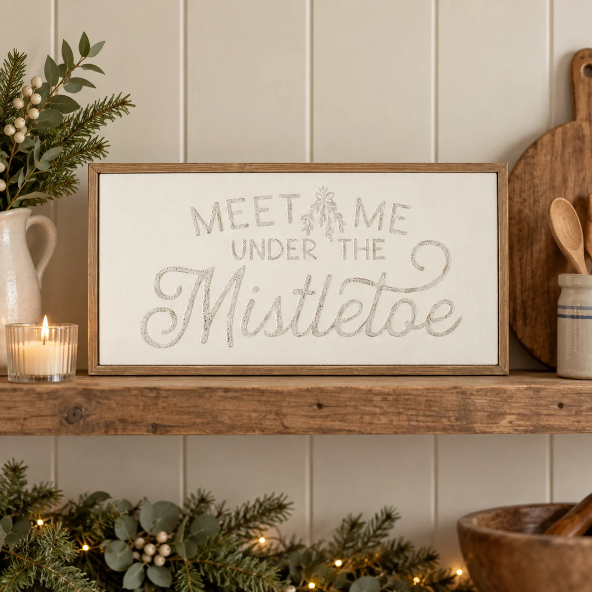 Wood & Metal Sign - White And Gold Meet Me Under The Mistletoe on a country kitchen shelf.
