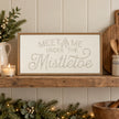 Wood & Metal Sign - White And Gold Meet Me Under The Mistletoe on a country kitchen shelf.