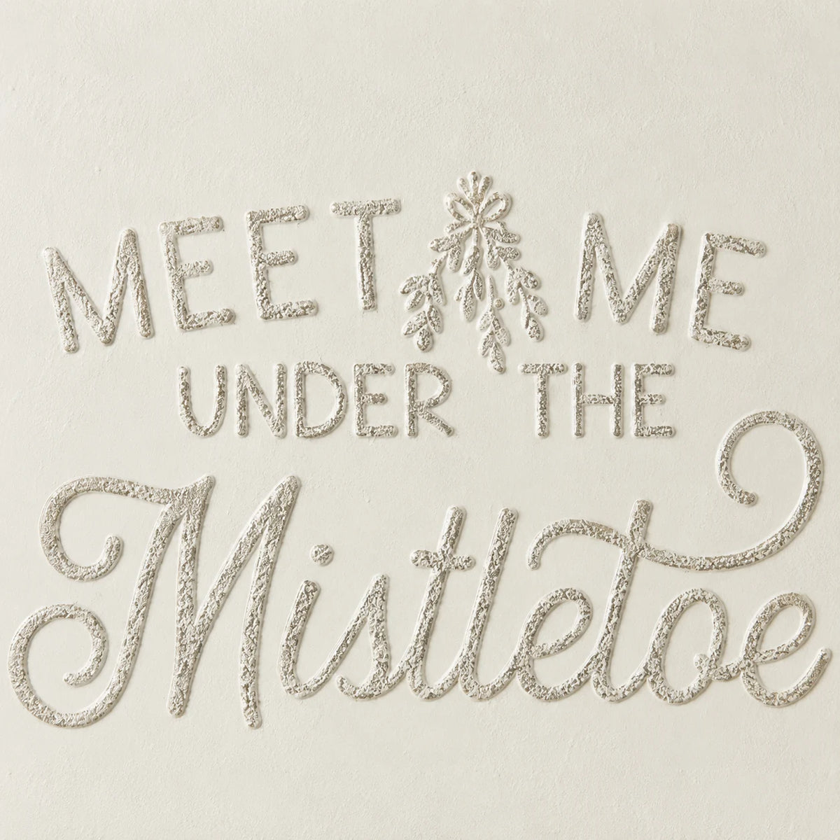 Close-up of original raised script lettering and cream metal surface on Wood & Metal Sign - White And Gold Meet Me Under The Mistletoe.