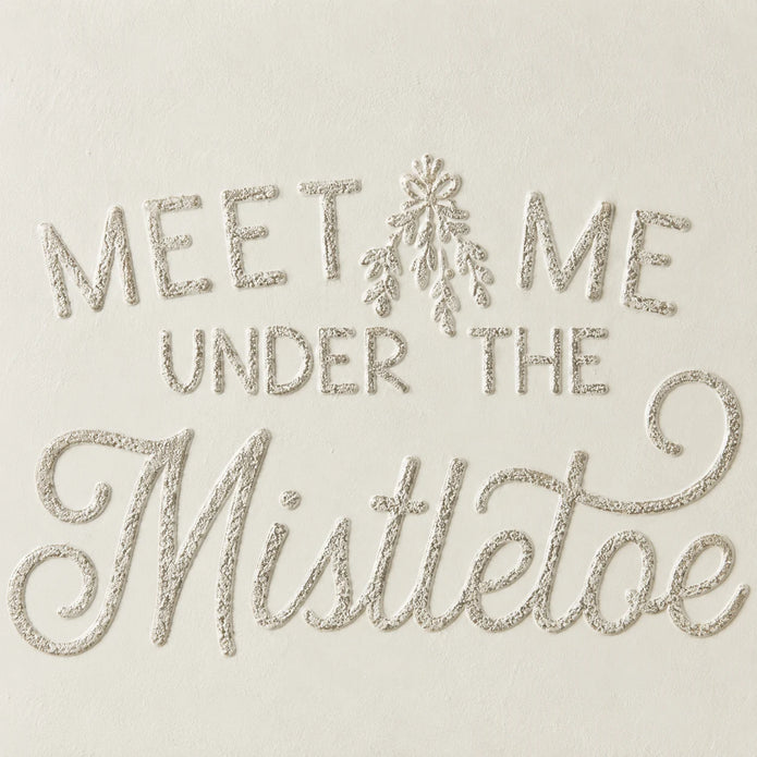 Close-up of original raised script lettering and cream metal surface on Wood & Metal Sign - White And Gold Meet Me Under The Mistletoe.