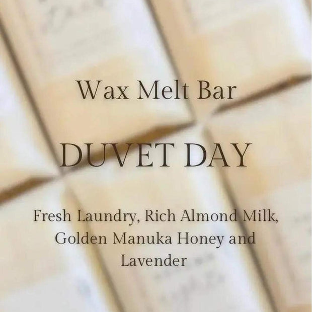 Meleri and Maple Co scented wax melt snap bar in Duvet Day fragrance, with a decorative packaging and wax pieces visible.
