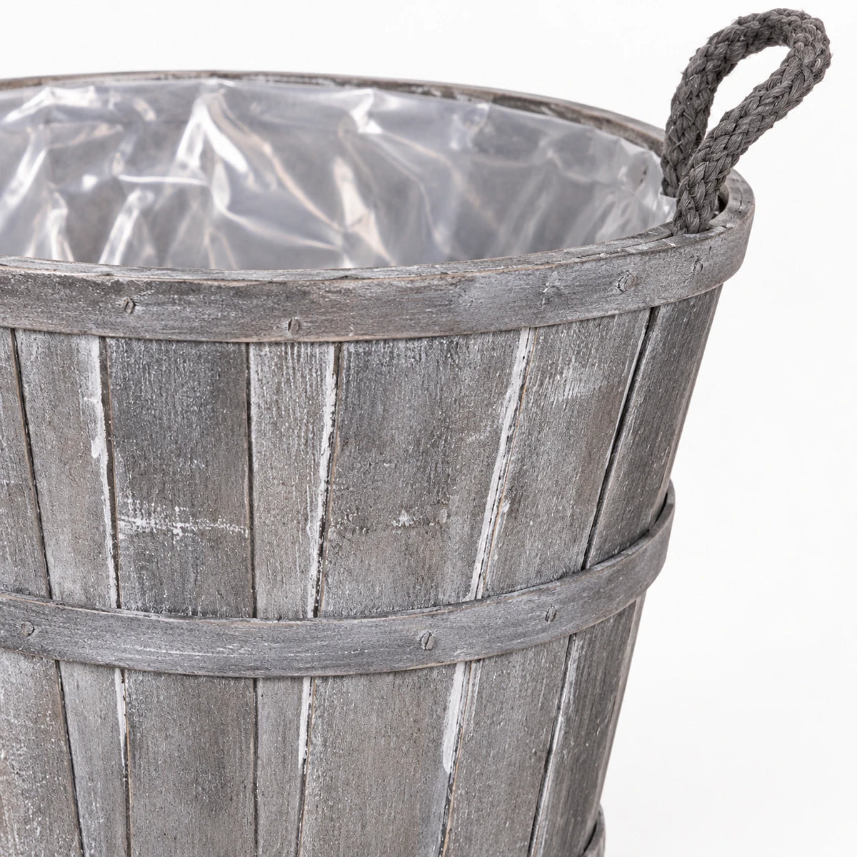 Close-up of medium Meon basket weathered grey stave finish, bands and rope handle