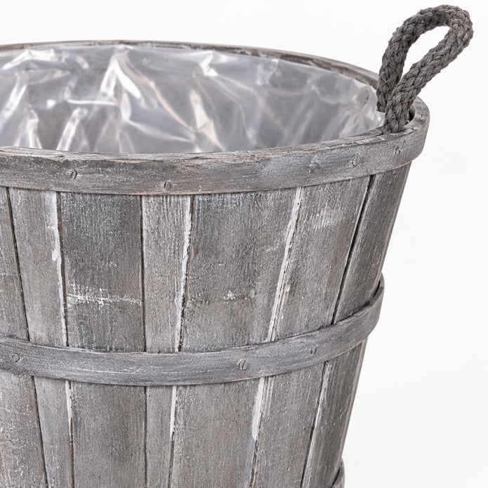 Close-up of medium Meon basket weathered grey stave finish, bands and rope handle