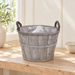 Empty small Meon planter basket with clear liner on an oak shelf