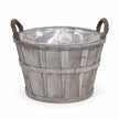 Small Meon planter basket with greywashed finish, rope handles and clear liner on white