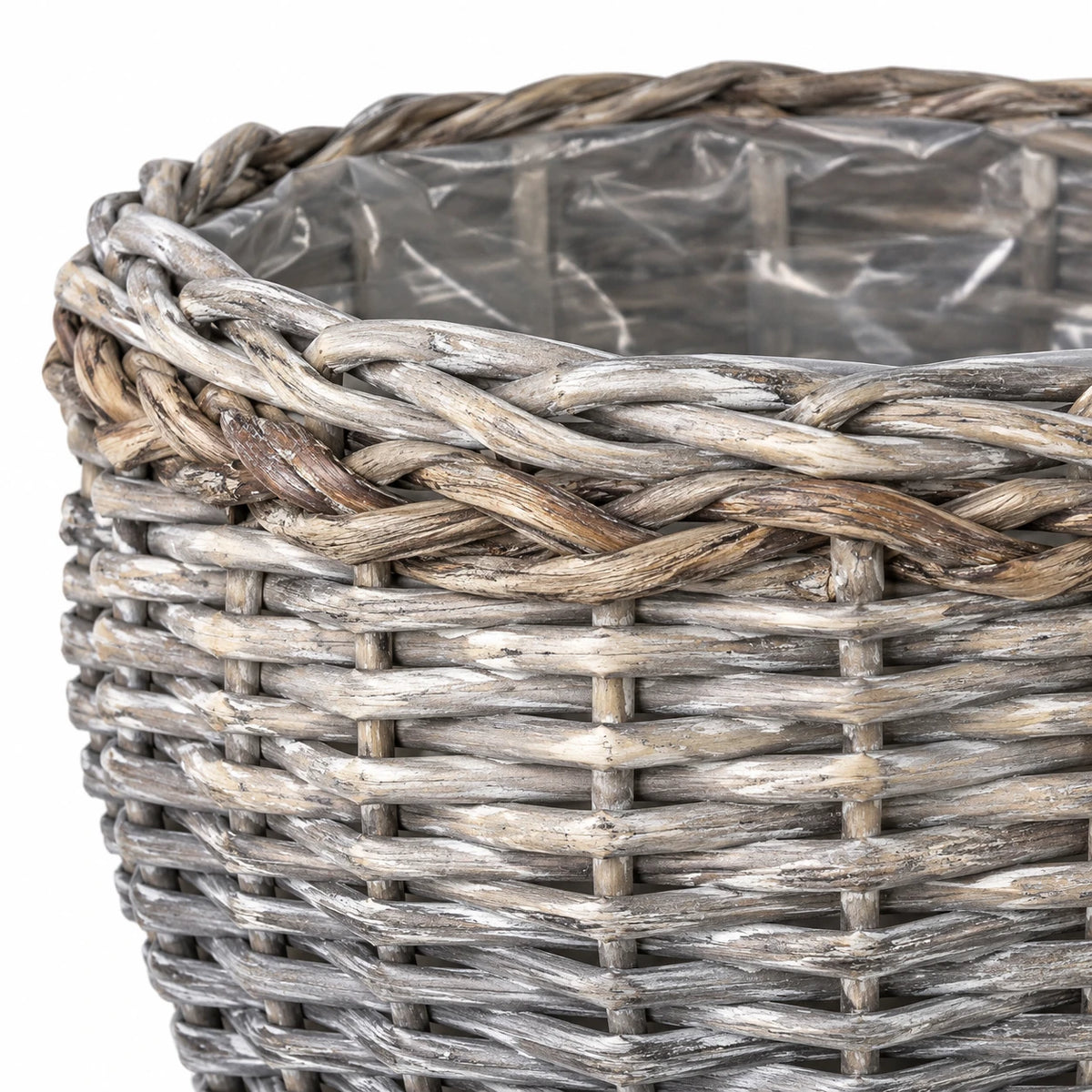 Close-up of the grey washed woven basket rim, braided detailing and clear liner