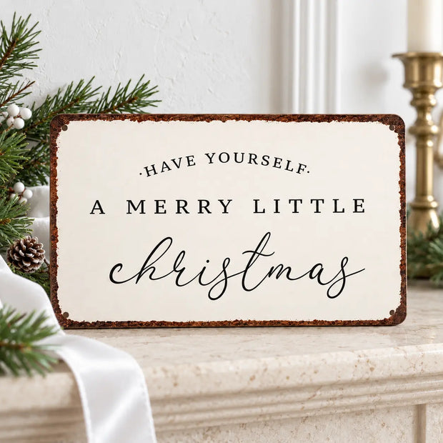 White Christmas Sign by Starlight Express with "Merry Christmas" lettering and white ribbon, ideal for holiday mantel decoration.