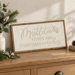 Wood & Metal Sign - White Mistletoe Kisses And Christmas Wishes on an oak console.