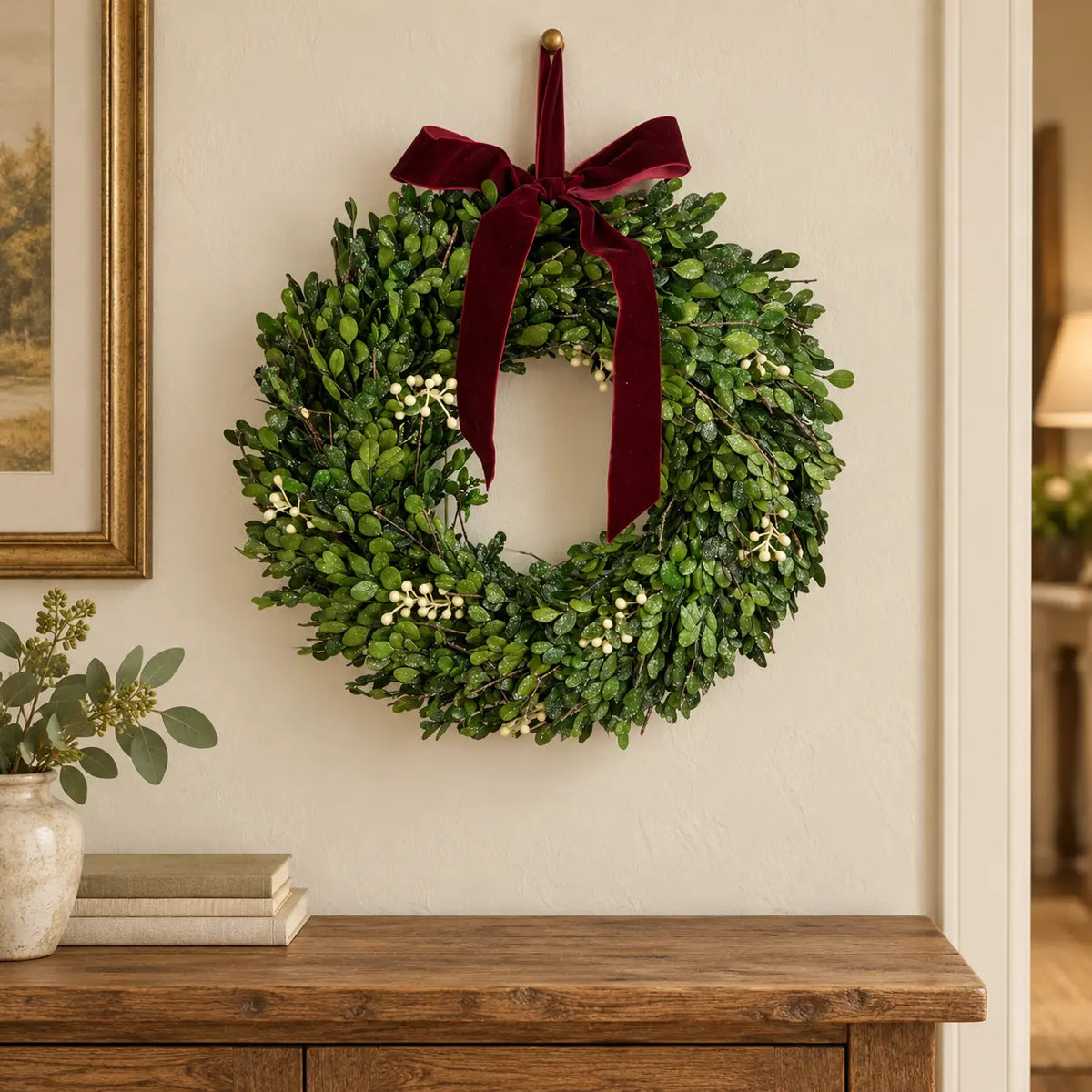 Christmas mistletoe wreath with burgundy bow, festive holiday decor by Satchville, featuring green foliage and decorative accents.