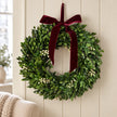 Christmas mistletoe wreath with burgundy bow and greenery, perfect for holiday decor from Satchville.