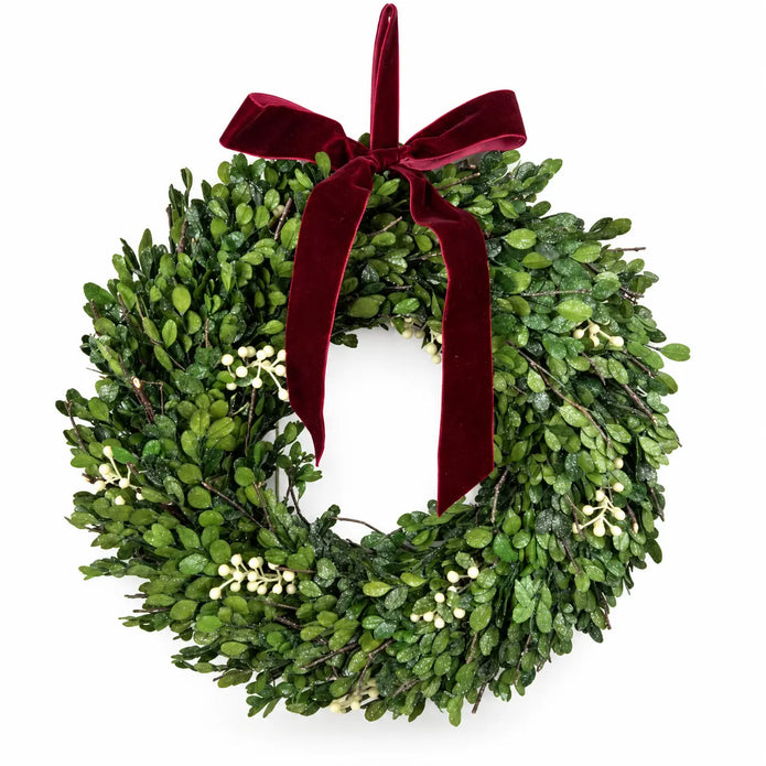 Christmas mistletoe wreath with burgundy bow, lush green foliage, and festive decorations, designed by Satchville.