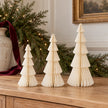 Three winter white standing paper trees in 20cm, 25cm and 30cm heights on an oak Christmas sideboard.