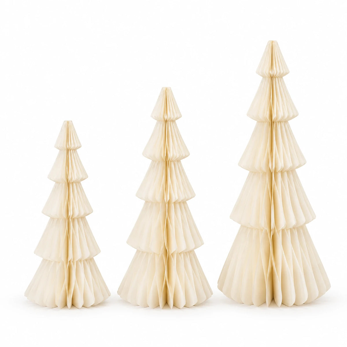 Full set of three winter white standing paper trees in ascending sizes on white.