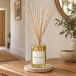 Heaven Scent MOROCCAN ROSE 100ml reed diffuser styled on an oak console with natural reeds inserted.