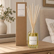 Heaven Scent MOROCCAN ROSE 100ml reed diffuser with reeds inserted beside its matching kraft gift box.