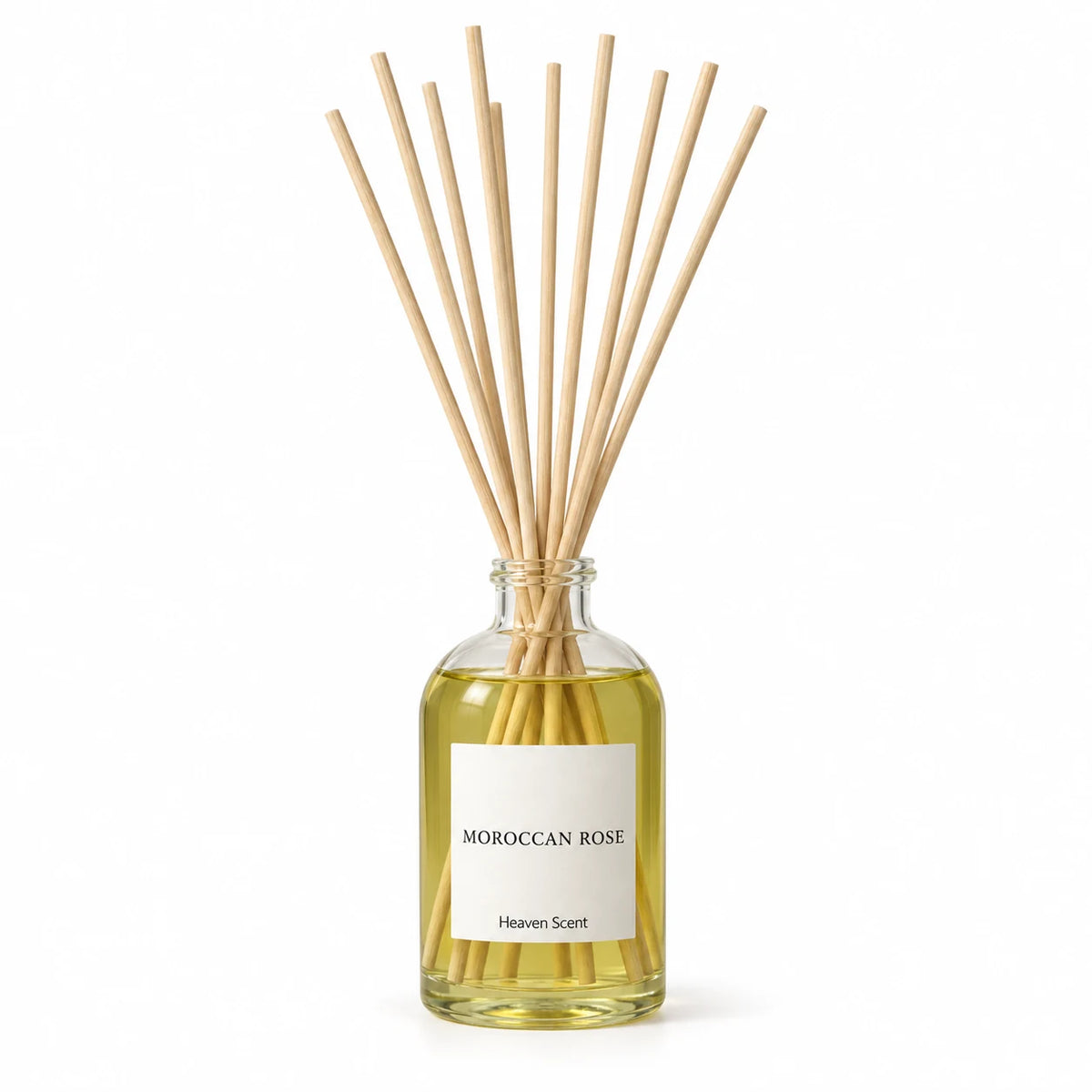 Heaven Scent MOROCCAN ROSE 100ml reed diffuser on white with natural reeds inserted.