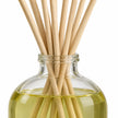 Heaven Scent MOROCCAN ROSE 100ml reed diffuser close-up of natural rattan reeds and the glass bottle neck.