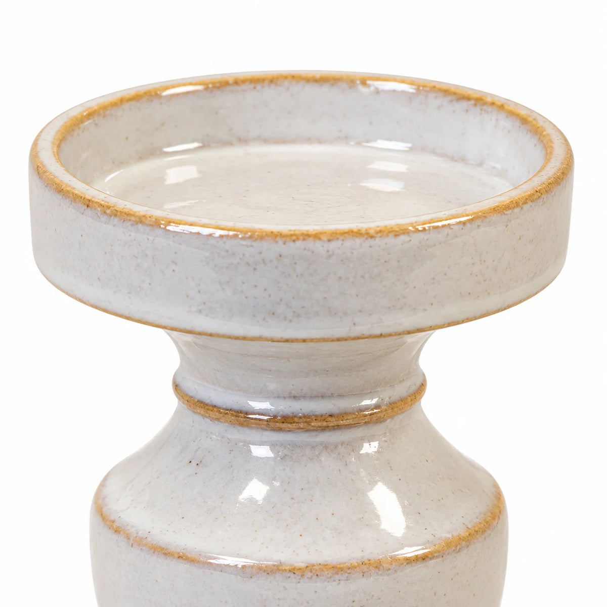 Close-up of the ivory ceramic candle dish with beige rim and glossy speckled glaze
