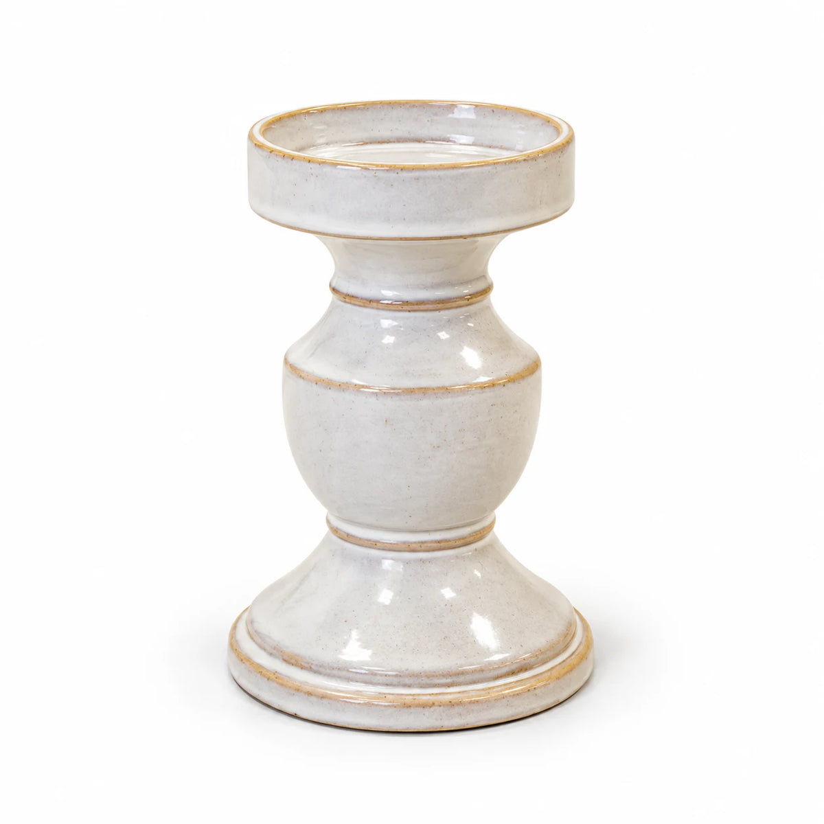 Medium natural ceramic candle holder with a round dish and turned pedestal on white
