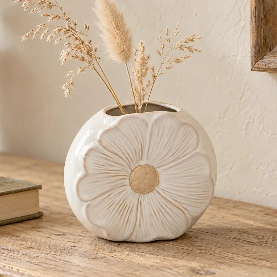 Satchville natural ceramic vase with flower design, featuring dried stems inside, ideal for decorative floral arrangements.