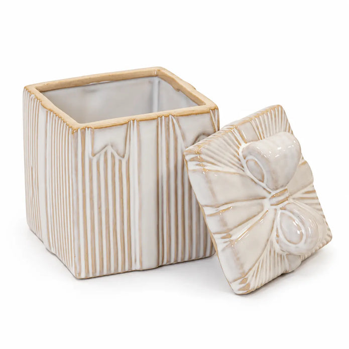 Natural ceramic gift box and separate bow lid on a white studio background