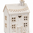 Close-up of the heart opening, windows and glazed roof of the natural ceramic tealight house