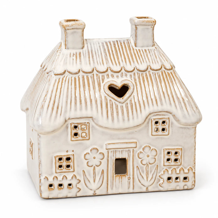 Natural ivory ceramic thatch roof tealight house, 16cm wide, studio view, shown empty.