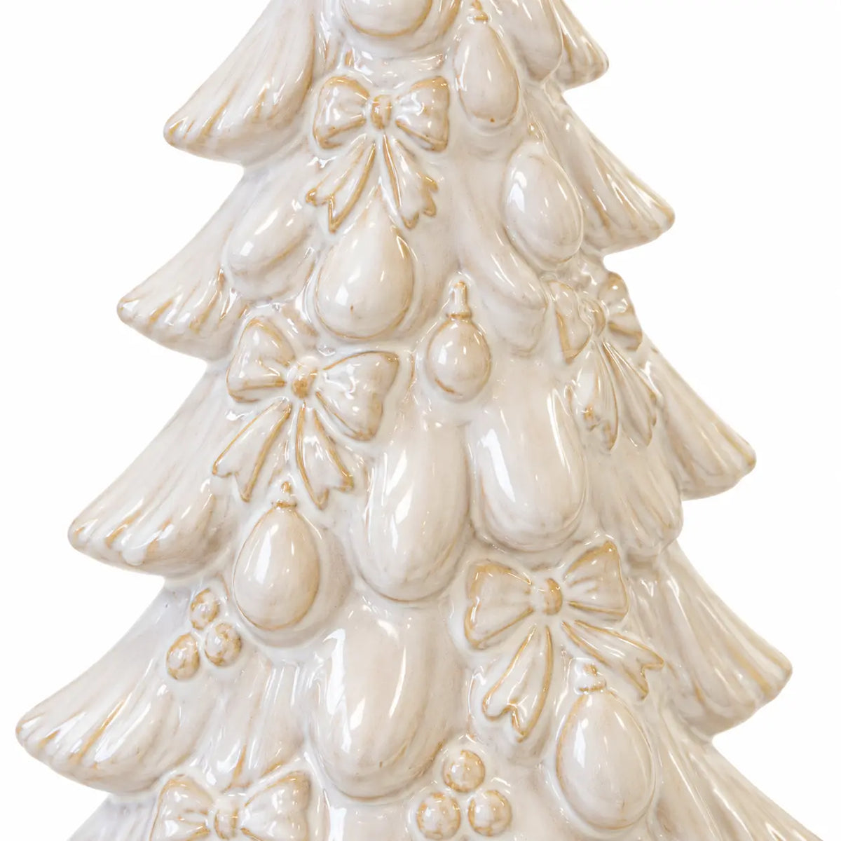 Close-up of embossed bows, baubles and layered branches on the natural glazed ceramic tree.