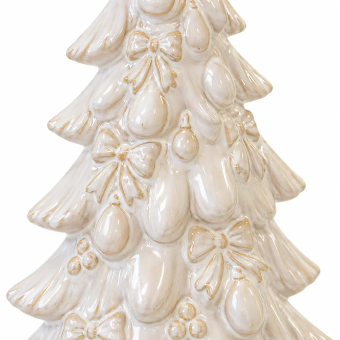 Close-up of embossed bows, baubles and layered branches on the natural glazed ceramic tree.