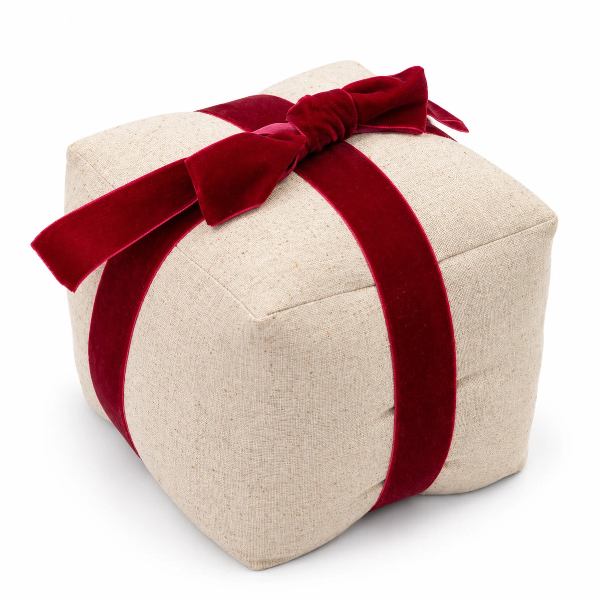 Elevated studio view of Christmas present doorstop showing linen texture and red velvet bow