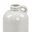 Close-up of the short jug vase neck, small loop handle and pale glossy glaze