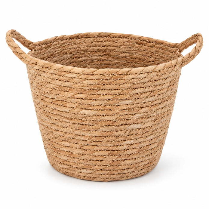 Single empty natural woven basket with two loop handles on a white background