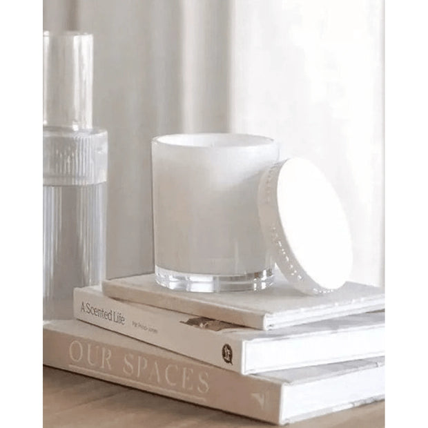 Naturals luxury glass lidded candle by Widdop & Co featuring rose, jasmine, and oud scent with a clear glass container and elegant lid.
