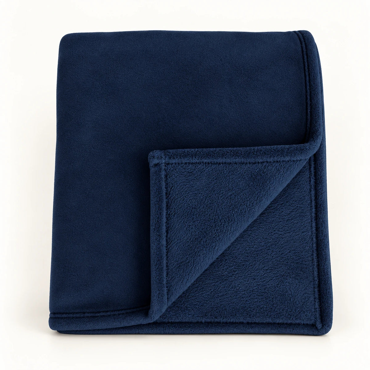 Navy Blue Luxury Snuggle Blanket Throw, folded navy blue throw with its corner turned back on white