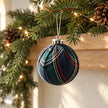 Navy blue tartan Christmas bauble from Starlight Express hanging on a holiday garland, festive and decorative.
