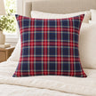 Navy and red check cushion cover styled on ivory bedding, inner not included