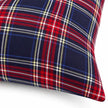Close-up of navy red and ivory tartan fabric and sewn cushion cover edge