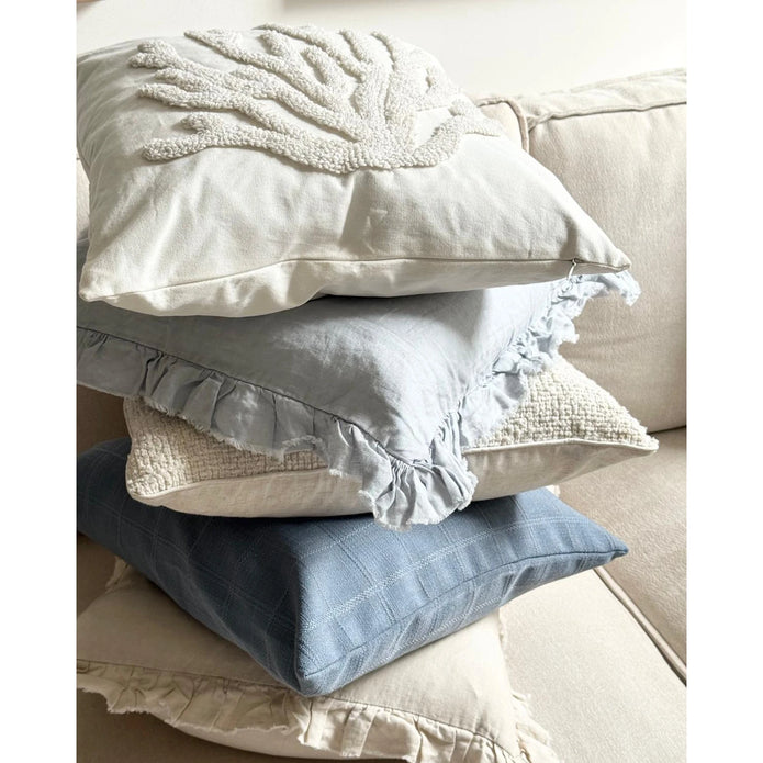 Neutral Embroidered Coral Cushion Cover, stack of cream and blue cushions with a coral design on top