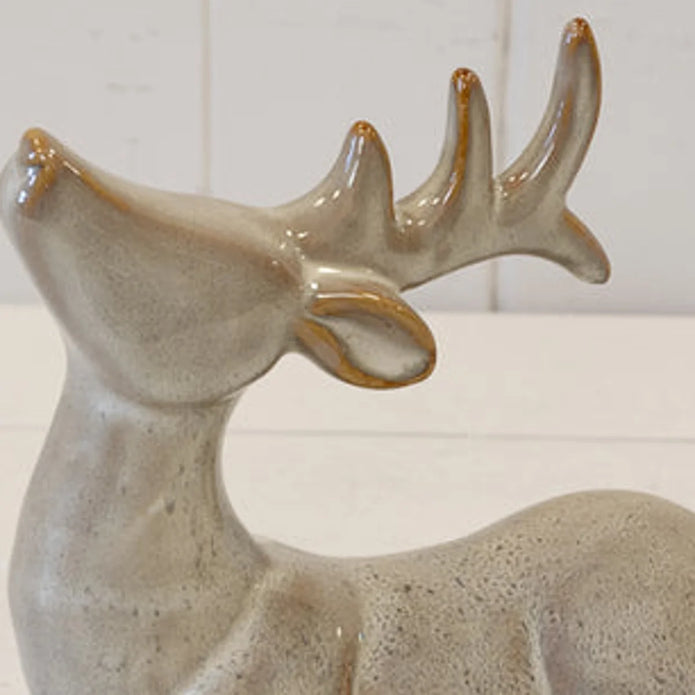 Close-up of neutral reindeer ceramic glaze and sculpted antlers with brown accents