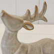 Close-up of neutral reindeer ceramic glaze and sculpted antlers with brown accents