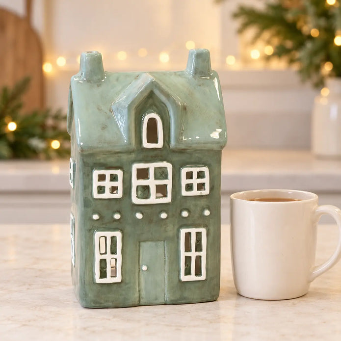 Satchville Nordic Green Ceramic Tealight Holder House - Large, styled in a kitchen countertop setting