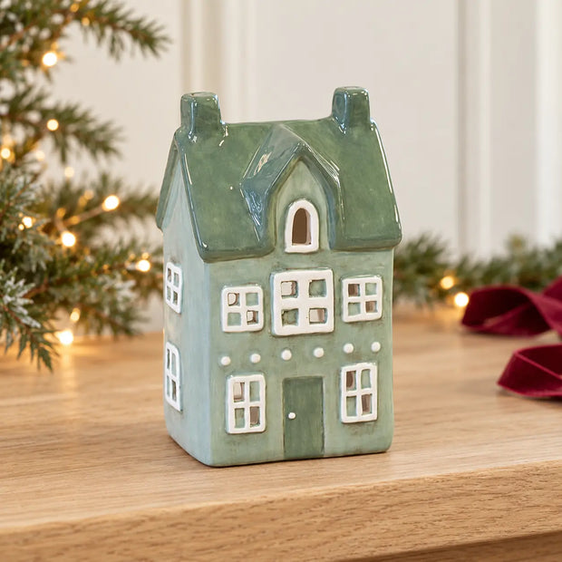 Satchville Nordic Green Ceramic Tealight Holder House - Small Christmas decoration on a console table