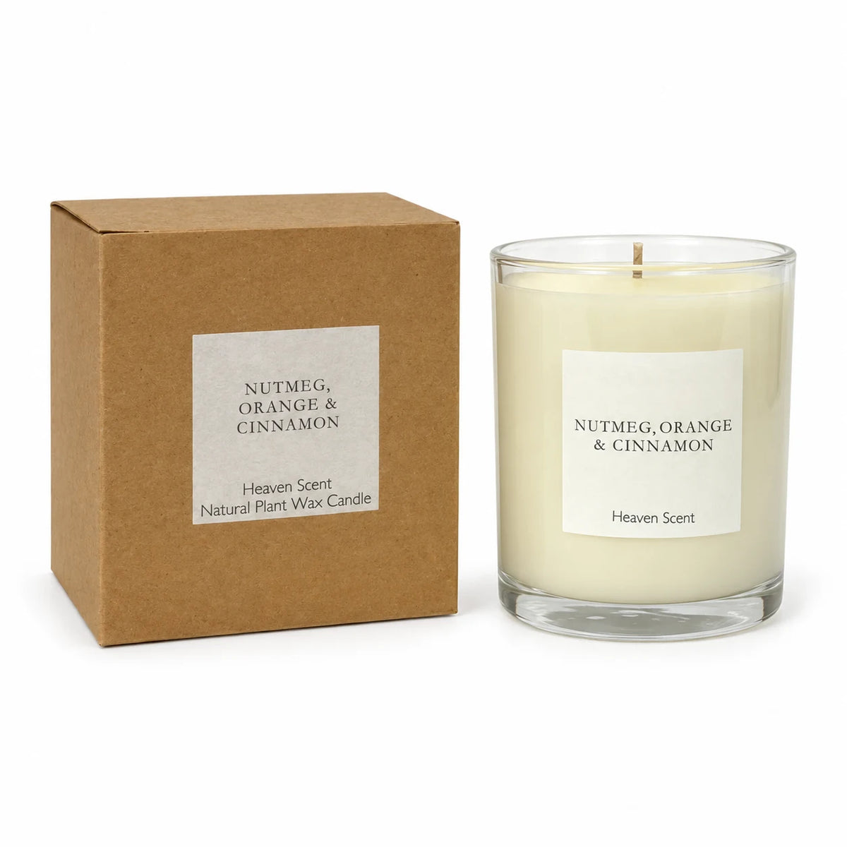 Heaven Scent Nutmeg, Orange + Cinnamon Medium Candle, unlit with its brown kraft box against white