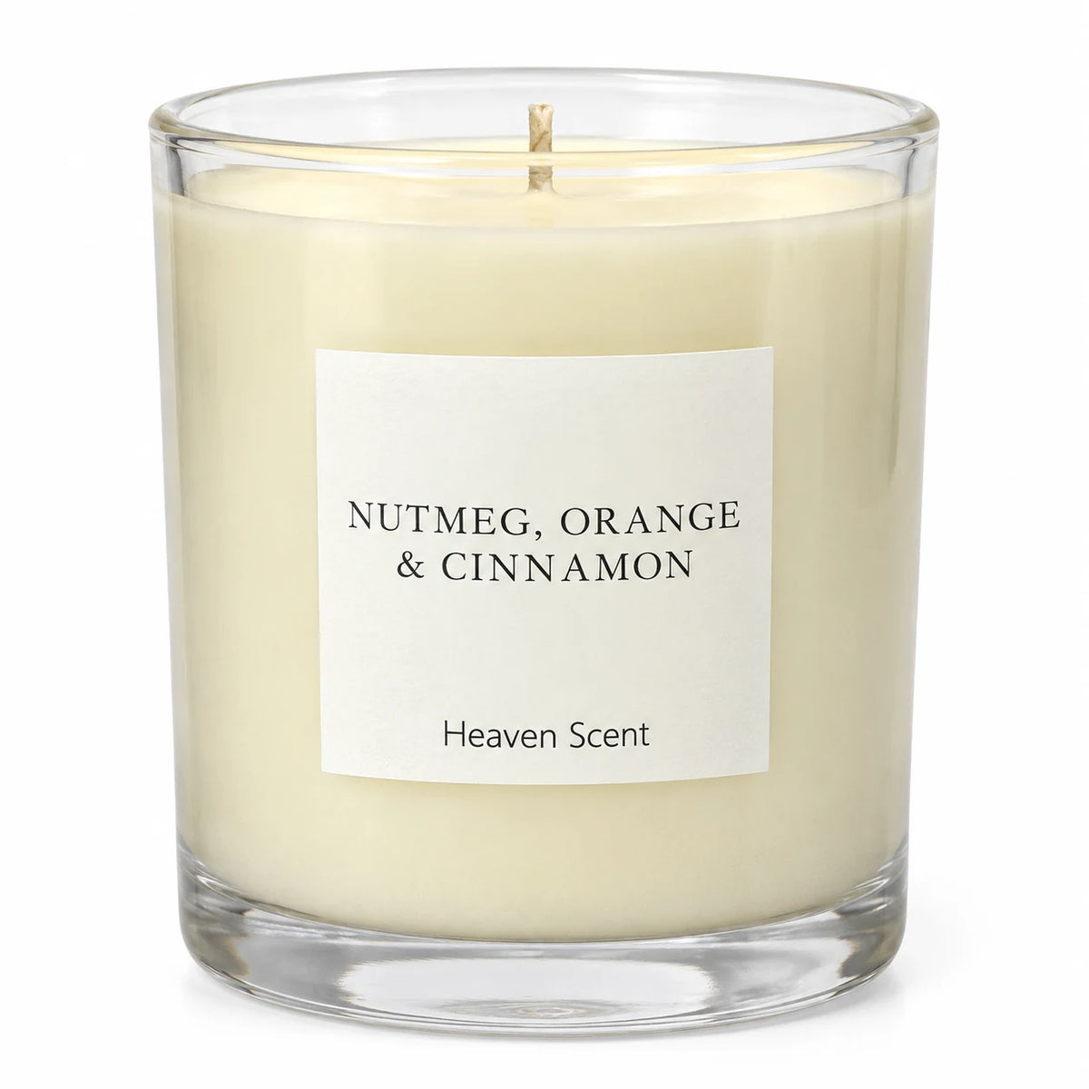 Heaven Scent Nutmeg, Orange + Cinnamon Medium Candle, close-up of the fragrance label and clear glass