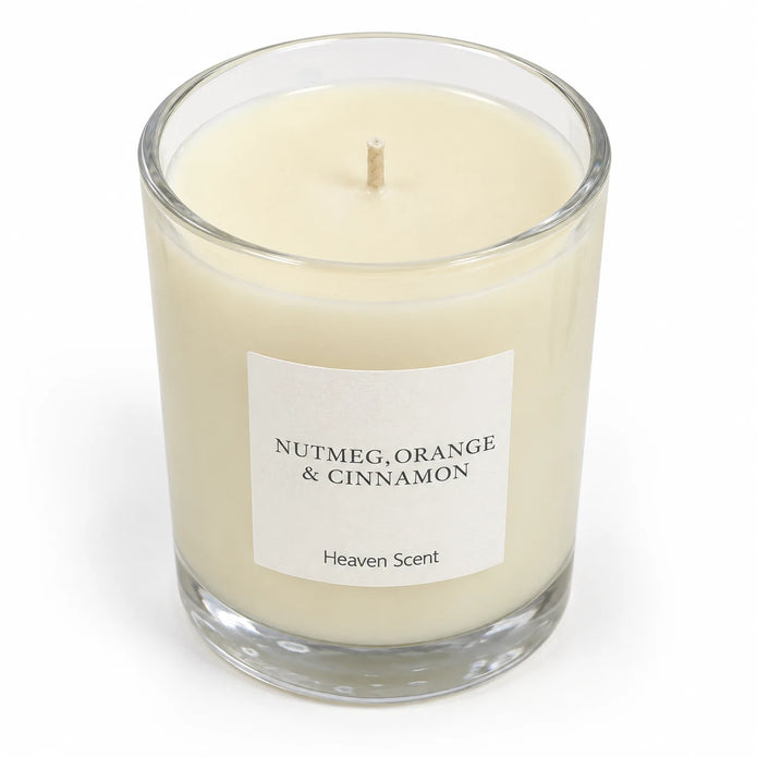 Heaven Scent Nutmeg, Orange + Cinnamon Medium Candle, close-up of cream wax and the unlit wick