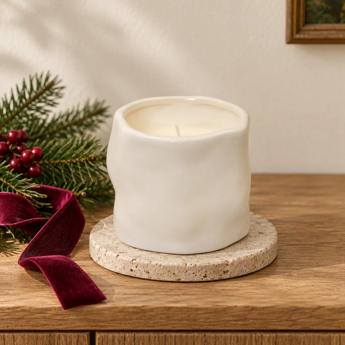 Off-white Satchville sculpted candle, elegant home decor piece with intricate detailing, ideal for festive or cozy settings.