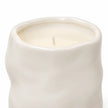 Off-white Satchville sculpted candle for home decor with intricate carved details, perfect for adding elegance to any space.