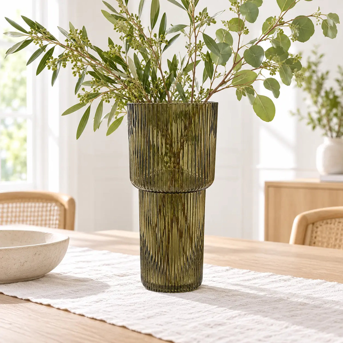 Satchville olive green tall glass ribbed vase with leafy foliage display